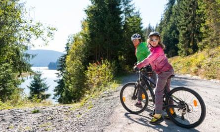 mother and daughter  mountain biking near Belis Fantanele Lake, Transylvania